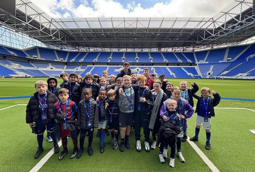 A big group of young players together at the stadium
